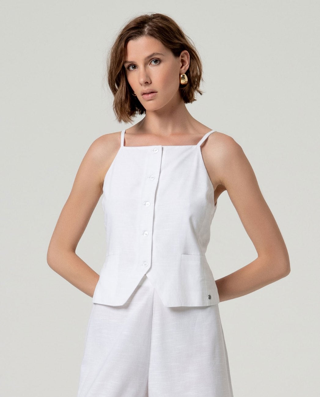Top gilet con bretella