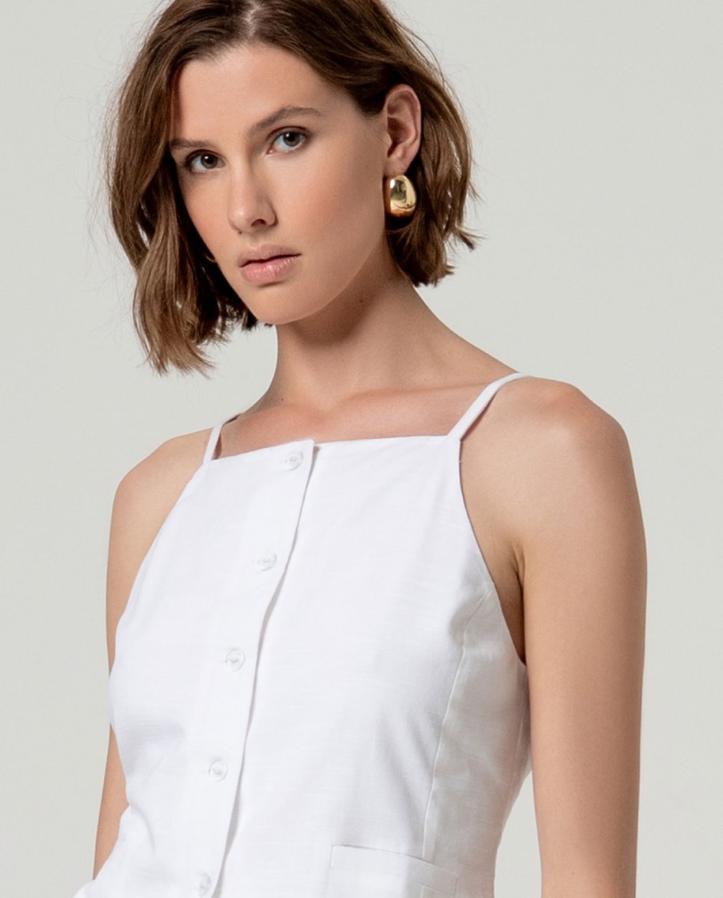 Top gilet con bretella