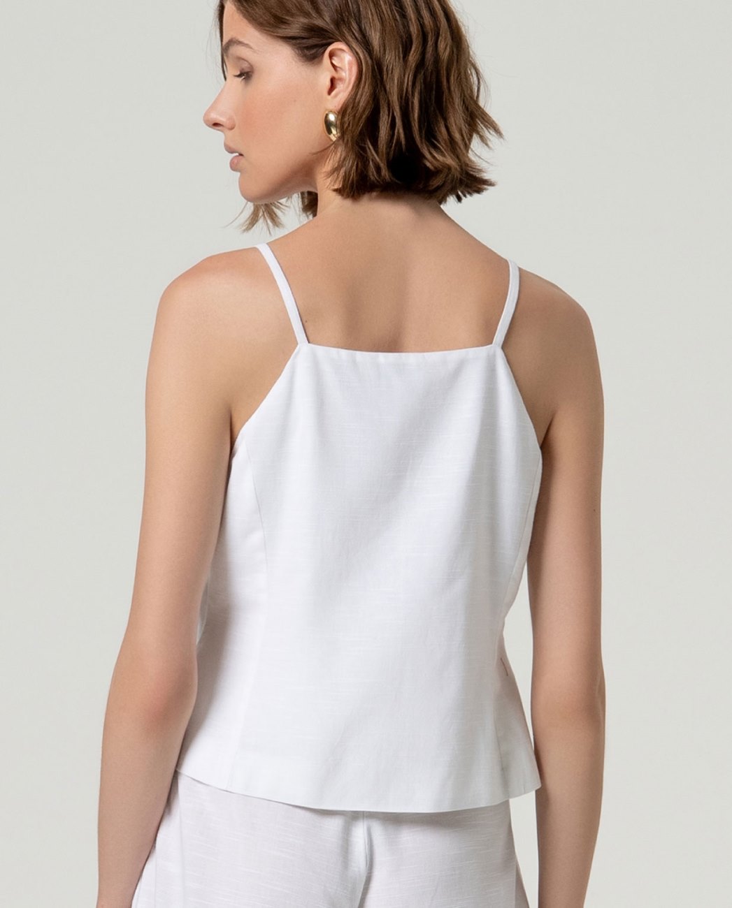 Top gilet con bretella